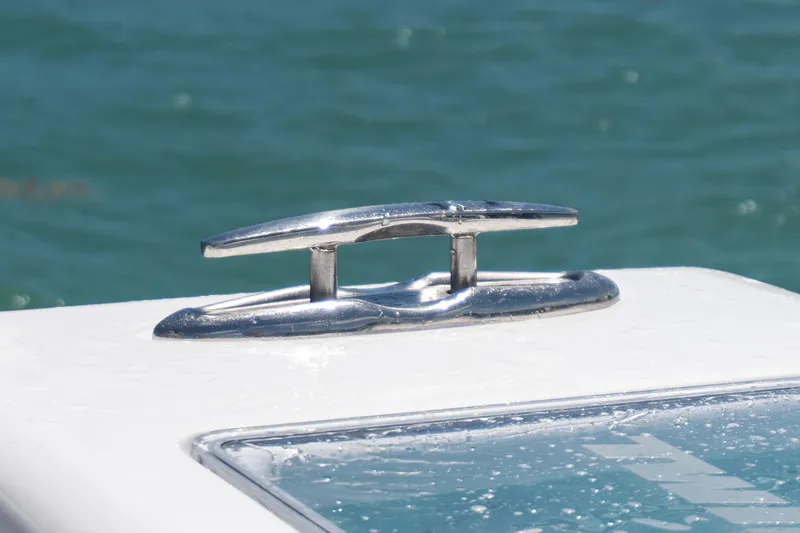 Slide: The Image of Chrome cleat on 2026 Twin Vee 340 GFX CC boat against ocean backdrop. - 5