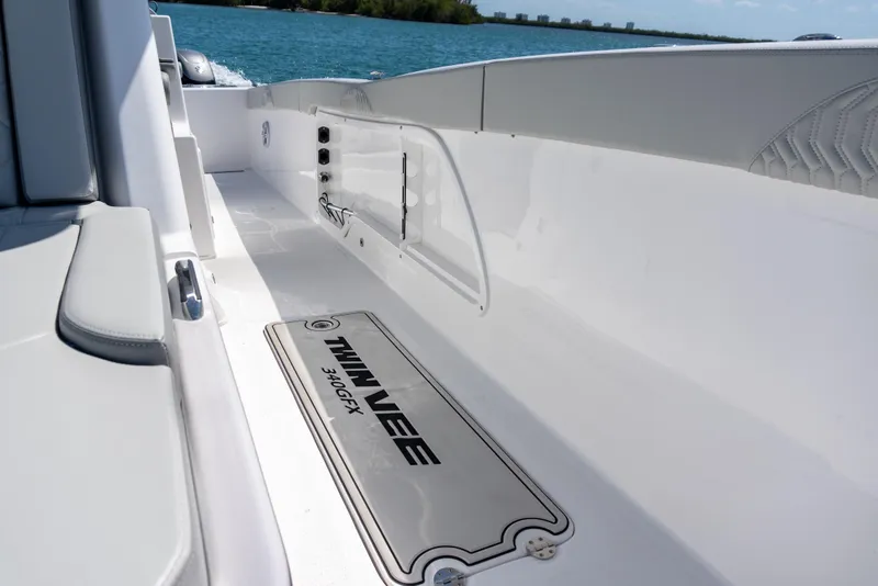 Slide: The Image of 2026 Twin Vee 340 GFX CC boat interior with sleek white design and seating. - 6
