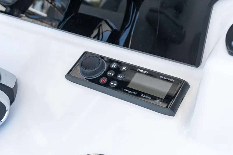 Slide: The Image of Fusion MS-RA70NSX audio system on 2026 Twin Vee 340 GFX CC boat dashboard. - 7