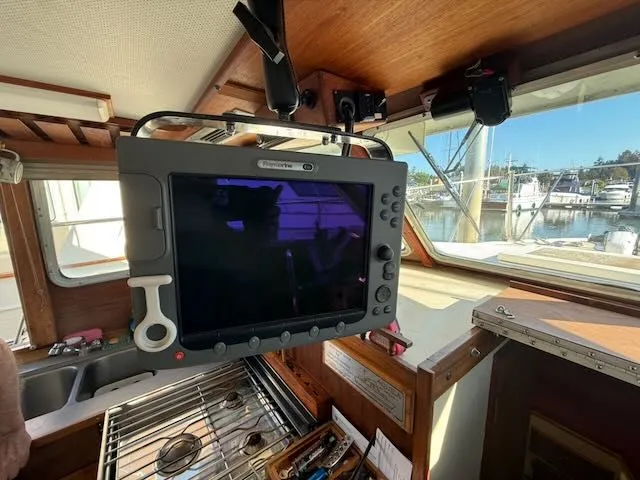 Slide: The Image of Interior of 1980 Tollycraft 34 with navigation system. - 11
