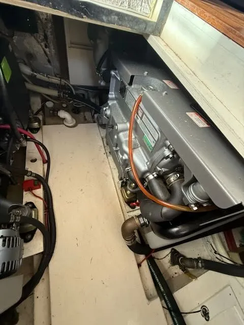 Slide: The Image of Engine compartment of a 1980 Tollycraft 34 boat with visible engine. - 14