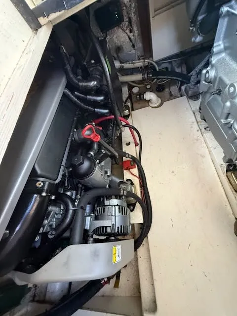 Slide: The Image of Engine compartment of a 1980 Tollycraft 34 boat, showing engine and wiring. - 16