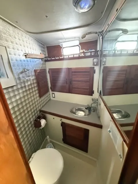 Slide: The Image of Interior view of 1980 Tollycraft 34 bathroom with mirror and sink. - 19