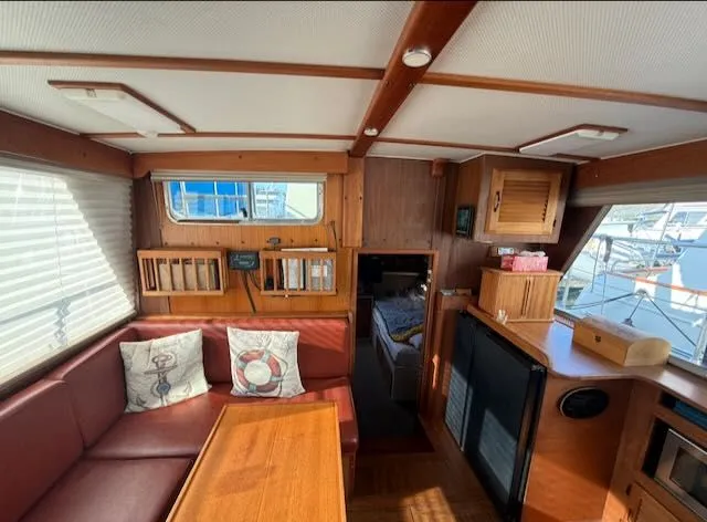 Slide: The Image of Interior of a 1980 Tollycraft 34 yacht with wooden furnishings. - 2