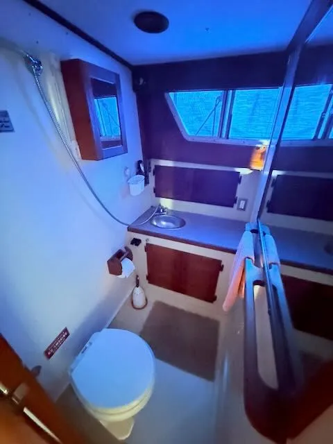 Slide: The Image of 1980 Tollycraft 34 yacht bathroom with toilet and sink. - 24