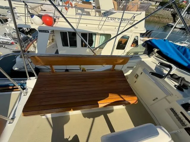 Slide: The Image of Wooden bench on 1980 Tollycraft 34 yacht in harbor. - 28