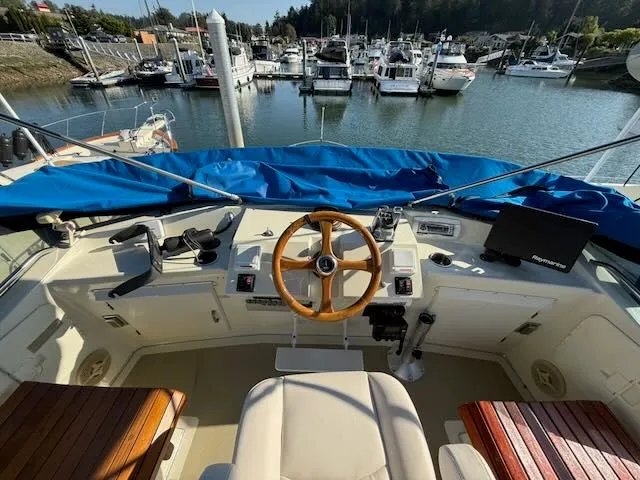 Slide: The Image of Cockpit of a 1980 Tollycraft 34 yacht in the marina. - 29