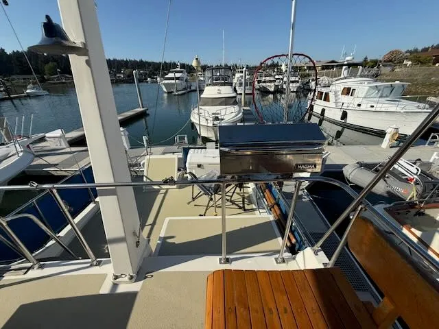Slide: The Image of 1980 Tollycraft 34 yacht docked with deck grill. - 32