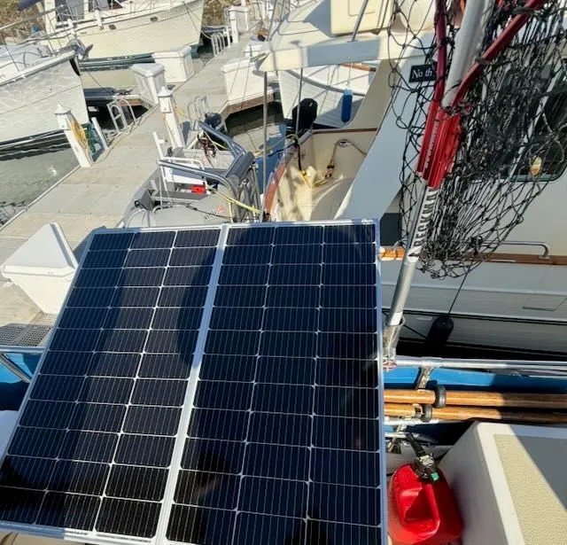 Slide: The Image of Solar panel on a 1980 Tollycraft 34 boat in the harbor. - 34