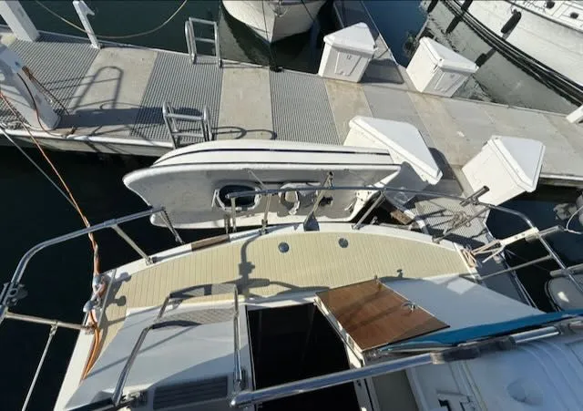 Slide: The Image of Aerial view of a 1980 Tollycraft 34 docked. - 35