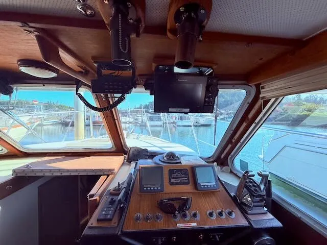 Slide: The Image of Interior view of 1980 Tollycraft 34 cockpit with navigation equipment. - 9
