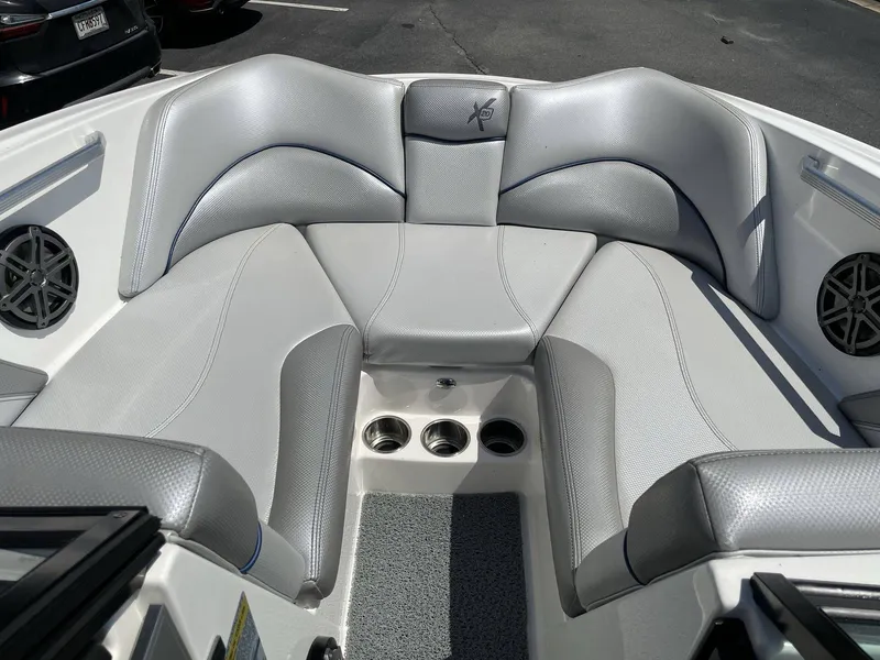 Slide: The Image of Interior of a 2016 MasterCraft X20 boat with gray upholstery. - 10