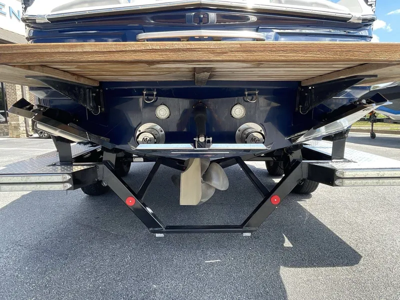Slide: The Image of Rear view of a 2016 MasterCraft X20 boat on a trailer. - 11