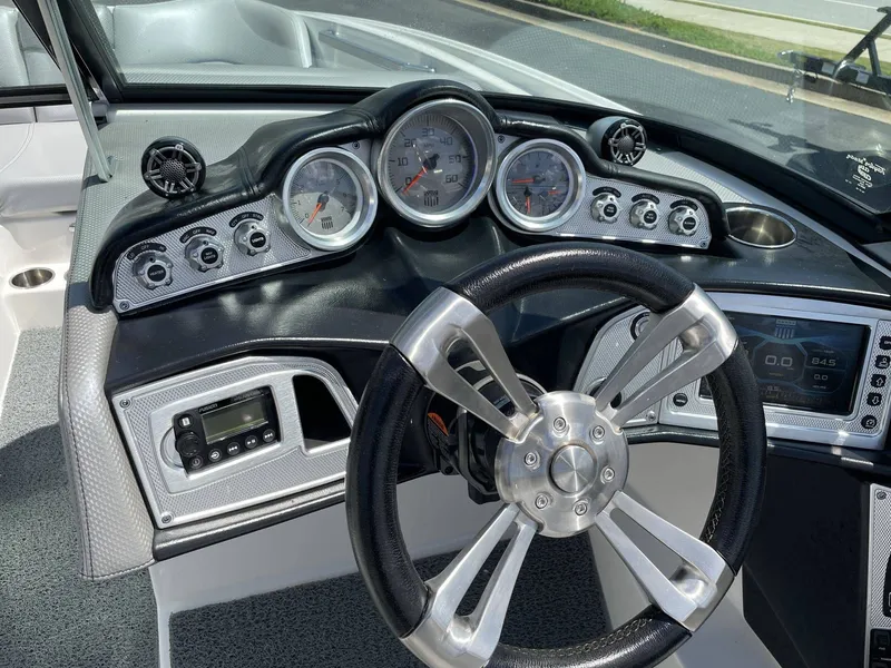 Slide: The Image of Dashboard of a 2016 MasterCraft X20 boat with modern gauges. - 12
