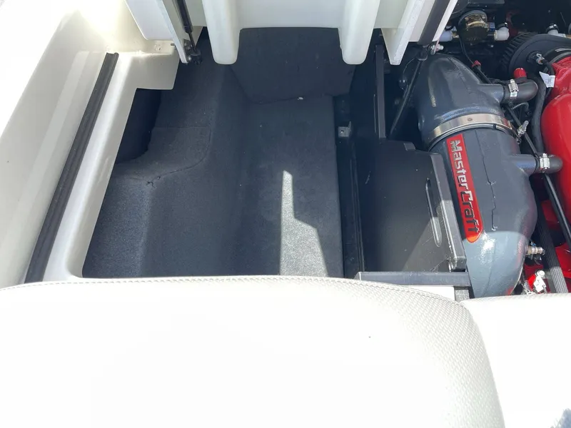 Slide: The Image of Engine compartment of a 2016 MasterCraft X20 boat. - 14