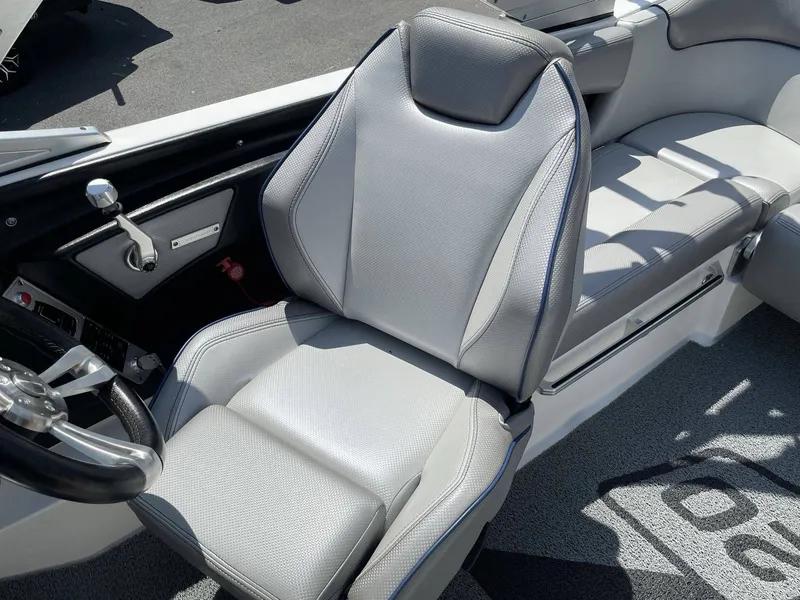 Slide: The Image of Interior of a 2016 MasterCraft X20 boat with gray seating. - 18