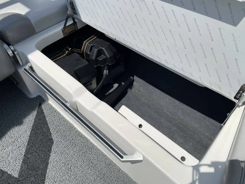 Slide: The Image of Storage compartment in 2016 MasterCraft X20 boat. - 20