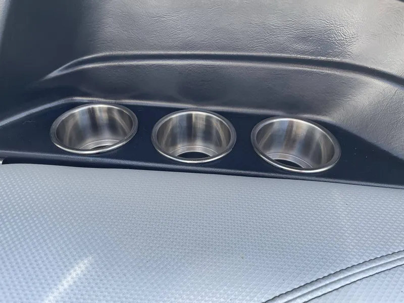 Slide: The Image of Three stainless steel cup holders in a 2016 MasterCraft X20 boat. - 25