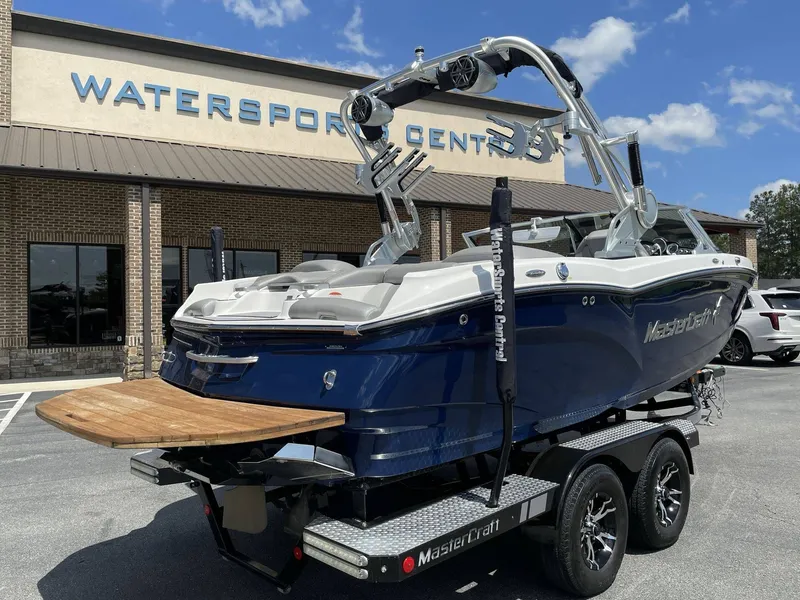 Slide: The Image of 2016 MasterCraft X20 boat outside Watersports Center. - 27