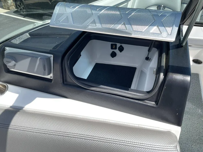 Slide: The Image of 2016 MasterCraft X20 boat with open storage compartment. - 34