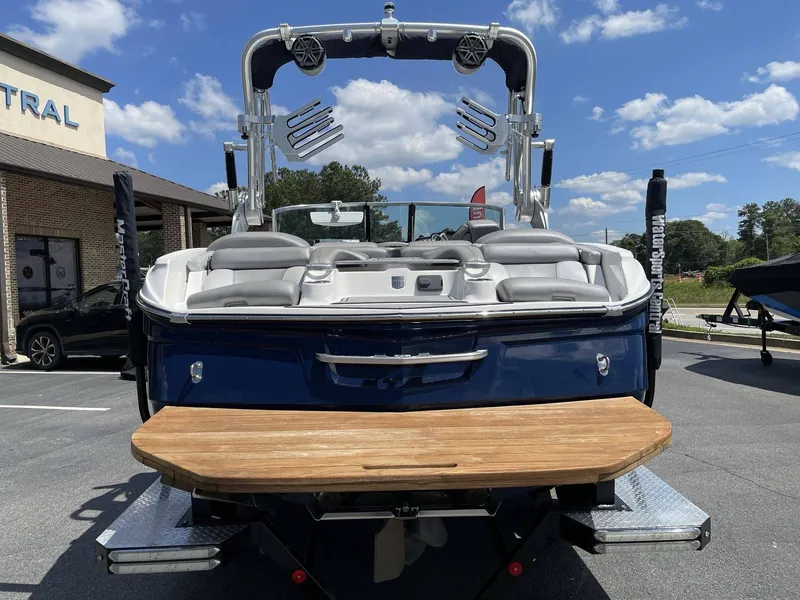 Slide: The Image of 2016 MasterCraft X20 boat, rear view in parking lot. - 7