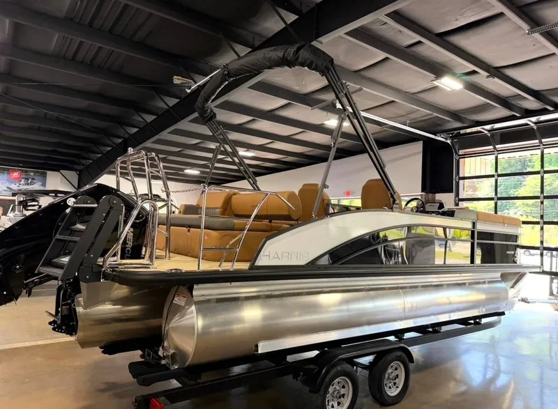 Slide: The Image of Harris Cruiser 230 pontoon boat 2026 in a showroom. - 6