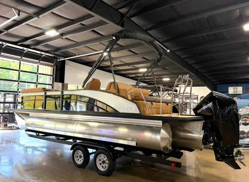 Slide: The Image of 2026 Harris Cruiser 230 pontoon boat in showroom. - 7