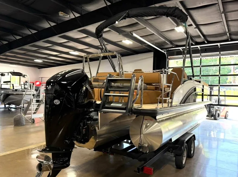 Slide: The Image of 2026 Harris Cruiser 230 pontoon boat in a warehouse. - 8