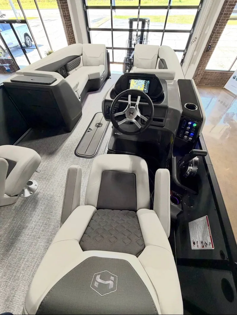 Slide: The Image of Interior of the 2026 Harris Sunliner 230 pontoon boat. - 12