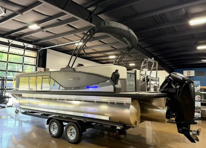 Slide: The Image of 2026 Harris Sunliner 230 pontoon boat in showroom. - 3