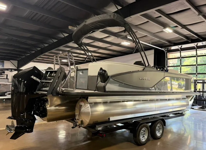 Slide: The Image of 2026 Harris Sunliner 230 pontoon boat in a showroom. - 5