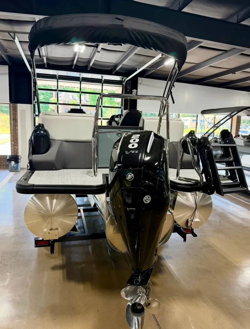 Slide: The Image of 2026 Harris Sunliner 230 pontoon boat with V6 engine in showroom. - 6