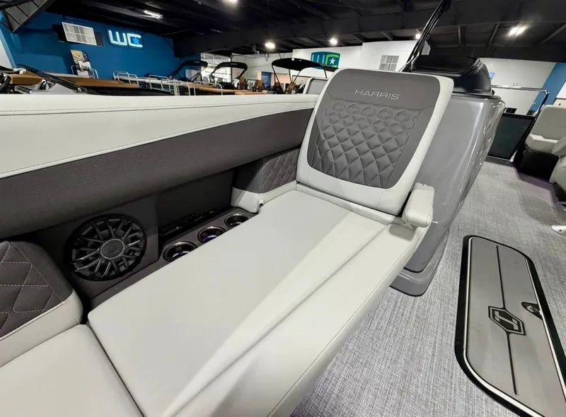 Slide: The Image of Interior of Harris Sunliner 230 boat, 2026 model, featuring luxurious seating. - 8