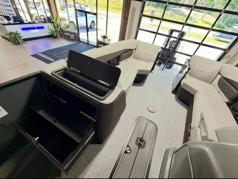 Slide: The Image of Interior of Harris Sunliner 230 pontoon boat, 2026 model, featuring luxurious seating. - 9