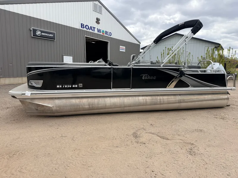 Slide: The Image of 2023 Tahoe LTZ 2385 Elite pontoon boat outside Boat World building. - 47
