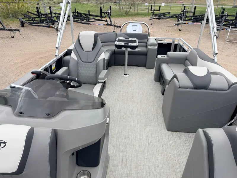 Slide: The Image of 2023 Tahoe LTZ 2385 Elite pontoon boat with gray seating. - 5