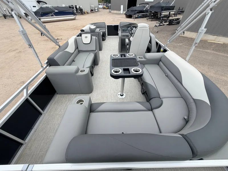 Slide: The Image of 2023 Tahoe LTZ 2385 Elite pontoon boat with gray seating. - 8