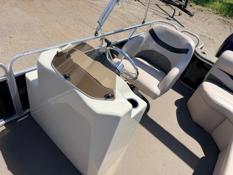 Slide: The Image of Interior view of a 2013 Qwest 7516 Adventure boat with steering console. - 20