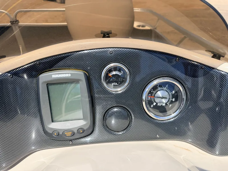 Slide: The Image of Dashboard of a Qwest 7516 Adventure boat with Humminbird display, 2013 model. - 23