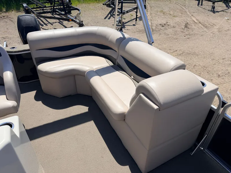 Slide: The Image of 2013 Qwest 7516 Adventure boat with beige seating area. - 25