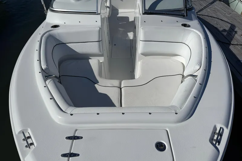Slide: The Image of 2017 Sea Hunt Escape 211 LE boat with spacious white seating area. - 10