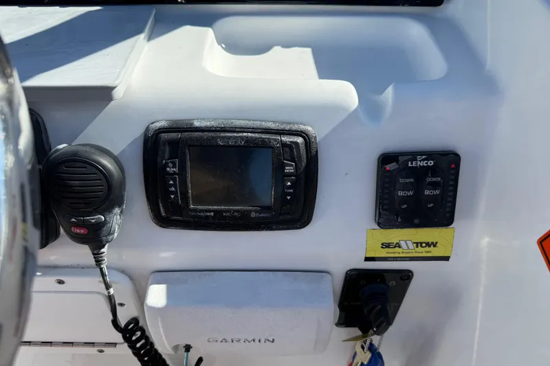 Slide: The Image of Control panel of a 2017 Sea Hunt Escape 211 LE boat with Garmin and Lenco devices. - 20
