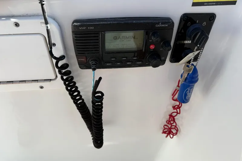 Slide: The Image of 2017 Sea Hunt Escape 211 LE boat dashboard with Garmin VHF 100 radio and Yamaha ignition. - 21