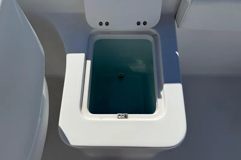 Slide: The Image of Open storage compartment on 2017 Sea Hunt Escape 211 LE boat. - 27
