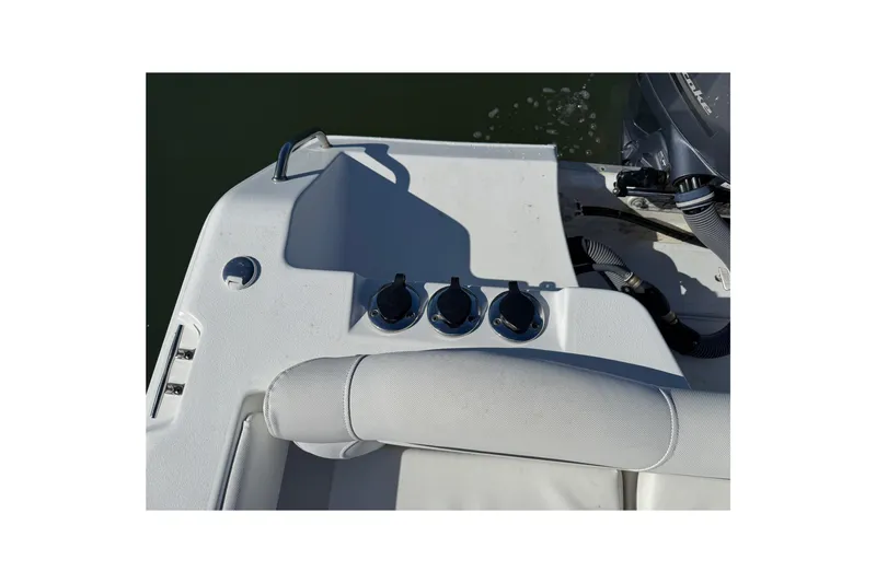 Slide: The Image of 2017 Sea Hunt Escape 211 LE boat controls and seating area. - 29