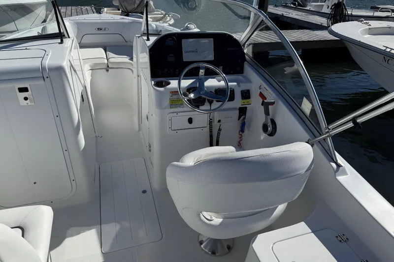 Slide: The Image of 2017 Sea Hunt Escape 211 LE boat interior with steering wheel and dashboard. - 31