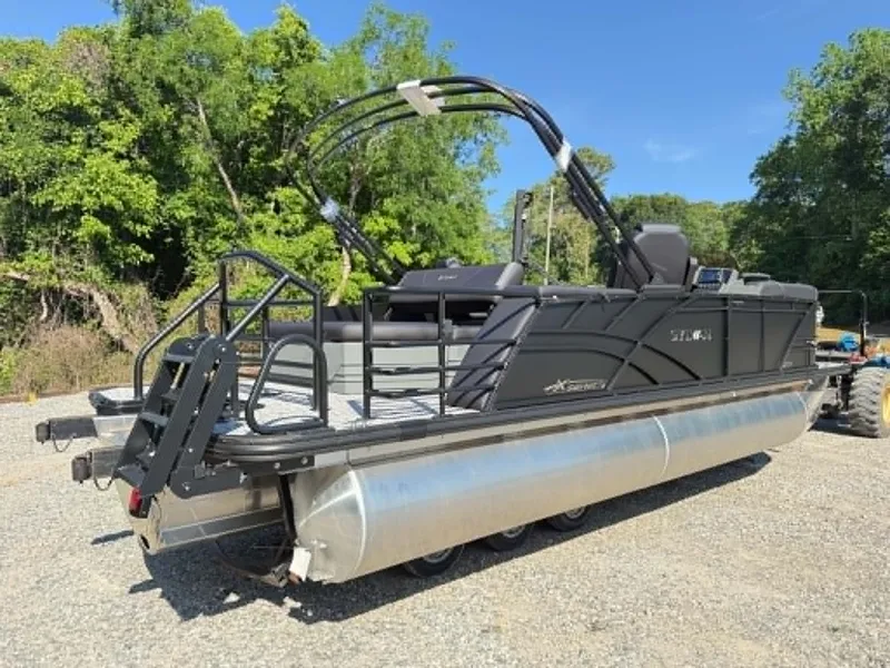 Slide: The Image of 2026 Sylvan X3 CLZ DH pontoon boat parked outdoors. - 17