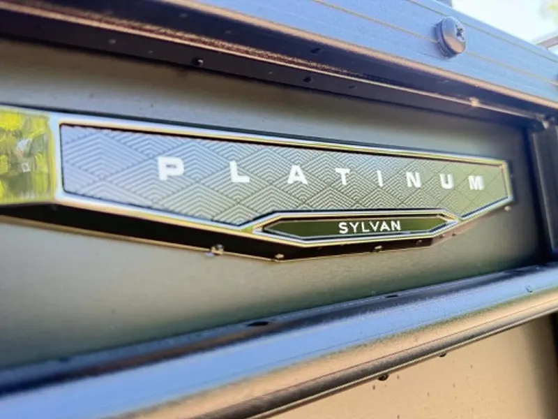 Slide: The Image of Close-up of Sylvan X3 CLZ DH 2026 Platinum emblem. - 23