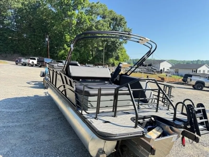 Slide: The Image of 2026 Sylvan X3 CLZ DH pontoon boat in parking lot on sunny day. - 24