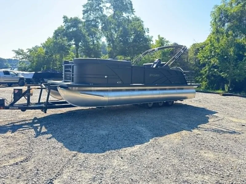 Slide: The Image of 2026 Sylvan X3 CLZ DH pontoon boat on trailer outdoors. - 29